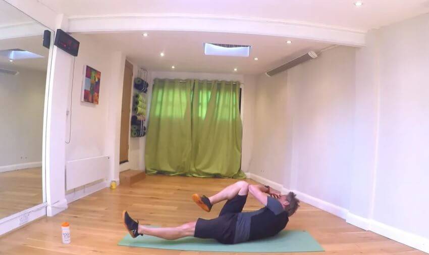 man doing hiit workout at home
